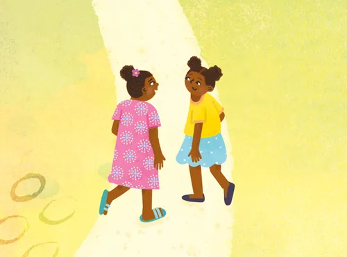 Two girls walking on a path