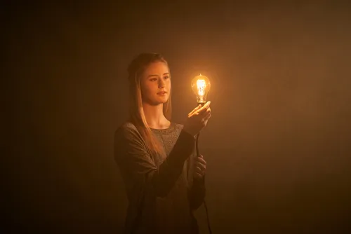 young woman with lightbulb