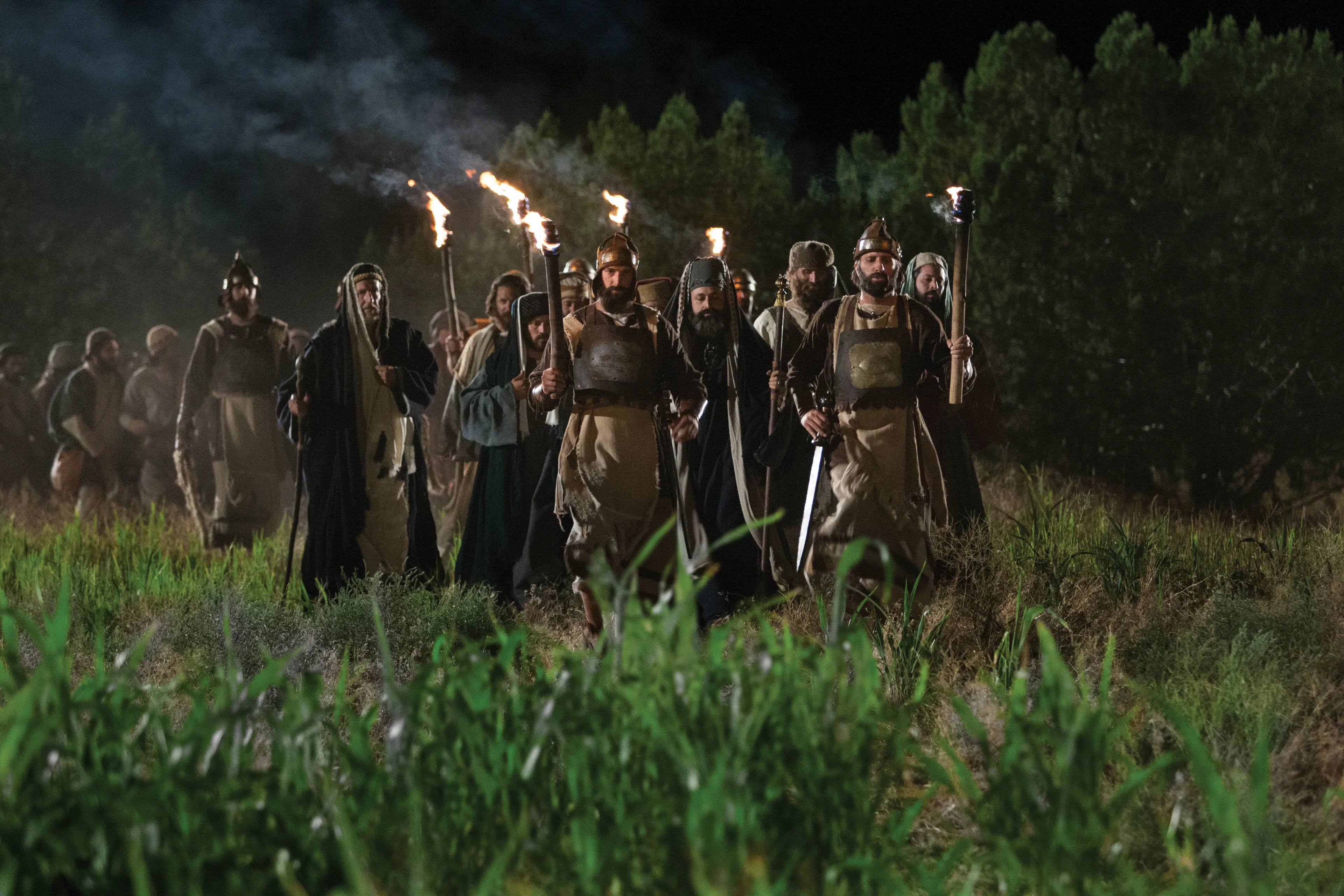 A group of soldiers and others approaching Gethsemane to arrest Jesus Christ.