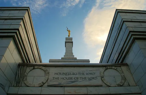The etching on the Columbus Ohio Temple that says, “Holiness to the Lord: The House of the Lord,” with the temple’s spire in the background.