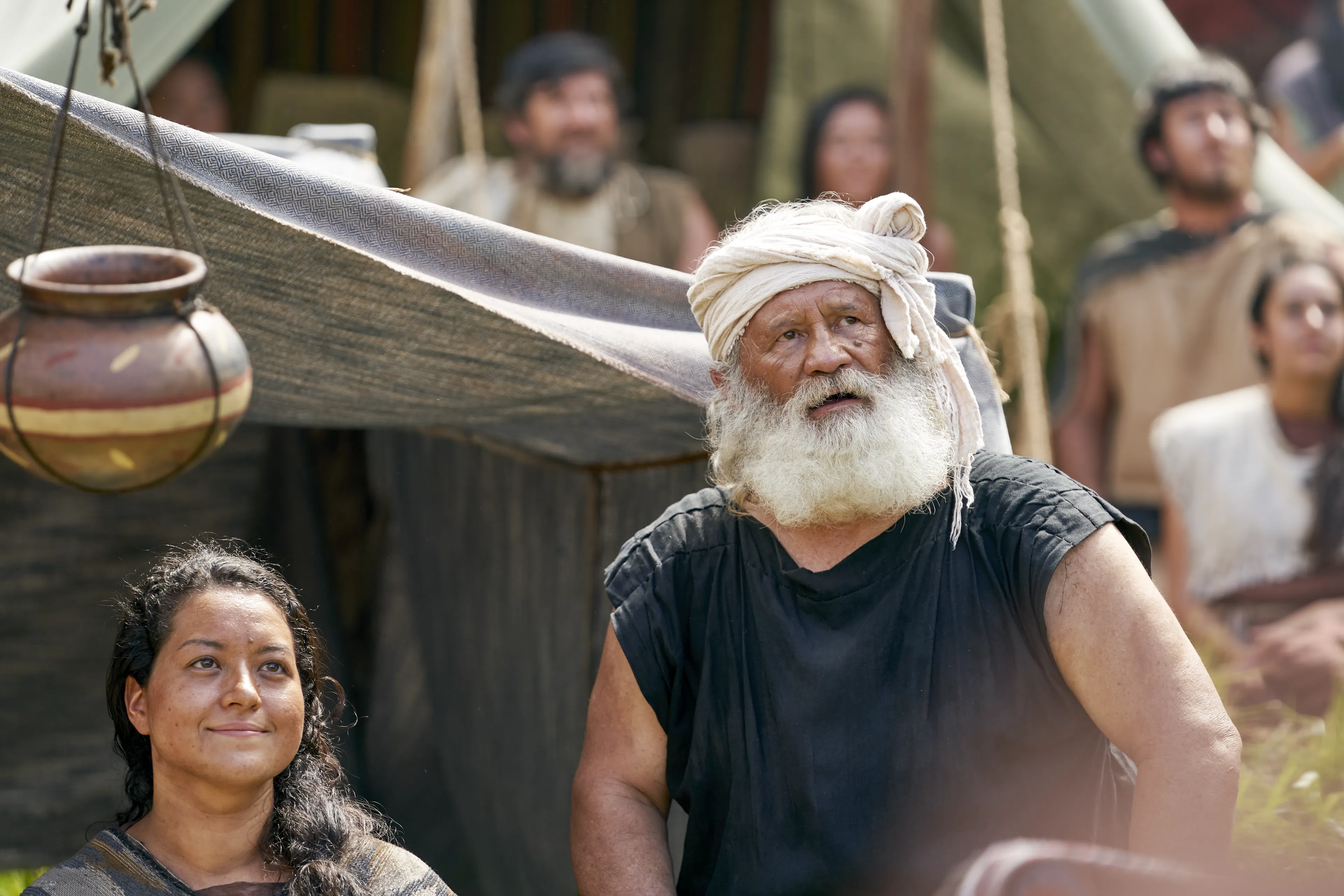 Men and women gather to listen to King Benjamin in the Land of Zarahemla.