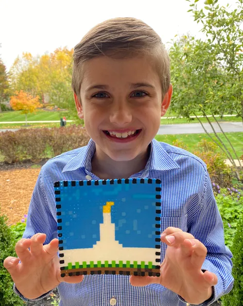 boy holding up temple craft