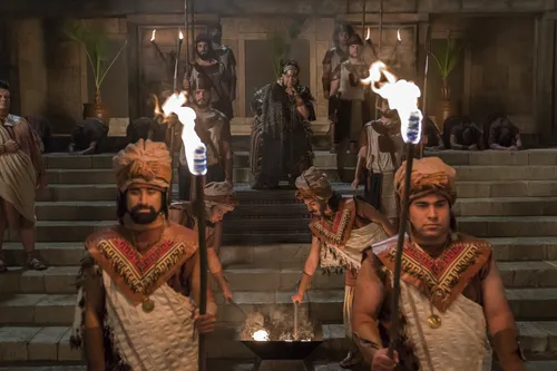 King Noah watches as Abinadi is put to death.