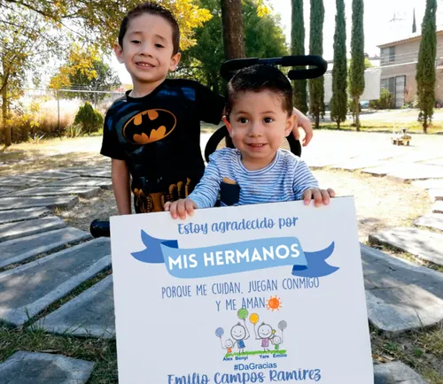 Alexander - Emilio holding up signs