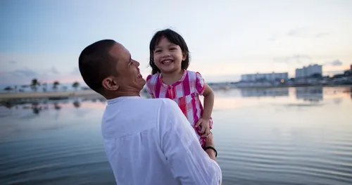 man holding small girl