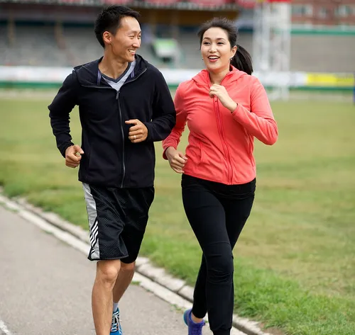 man and woman jogging