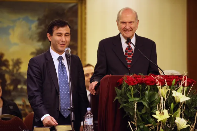 Varuzhan Poghosyan (left) translates for Elder Russell M. Nelson of the Quorum of the Twelve Apostles. Elder Nelson created the first stake of the Church in Yerevan, Armenia.