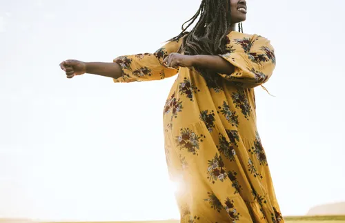young woman dancing outside