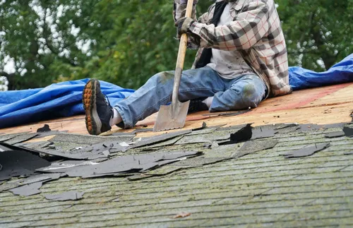 man repairing roof