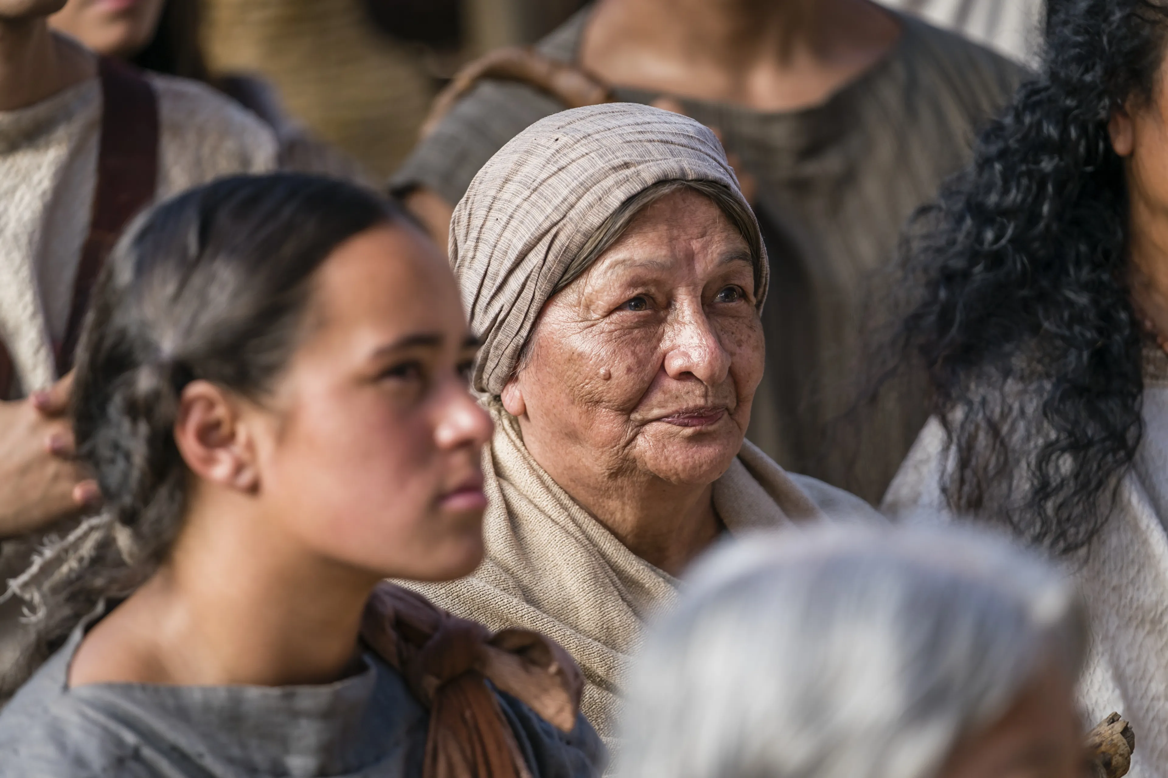 An elderly woman listens as Alma the Younger preaches to the people of Gideon.