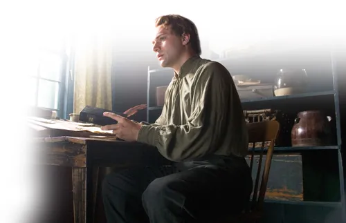 Church video depiction of Joseph Smith at writing desk