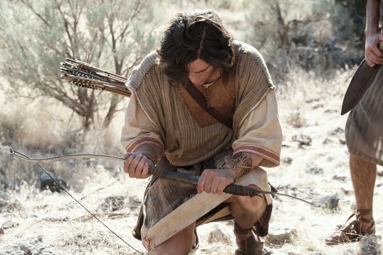 Nephi breaks his bow in the wilderness.