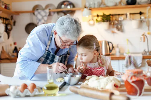 a grandmother and a child making a meal together