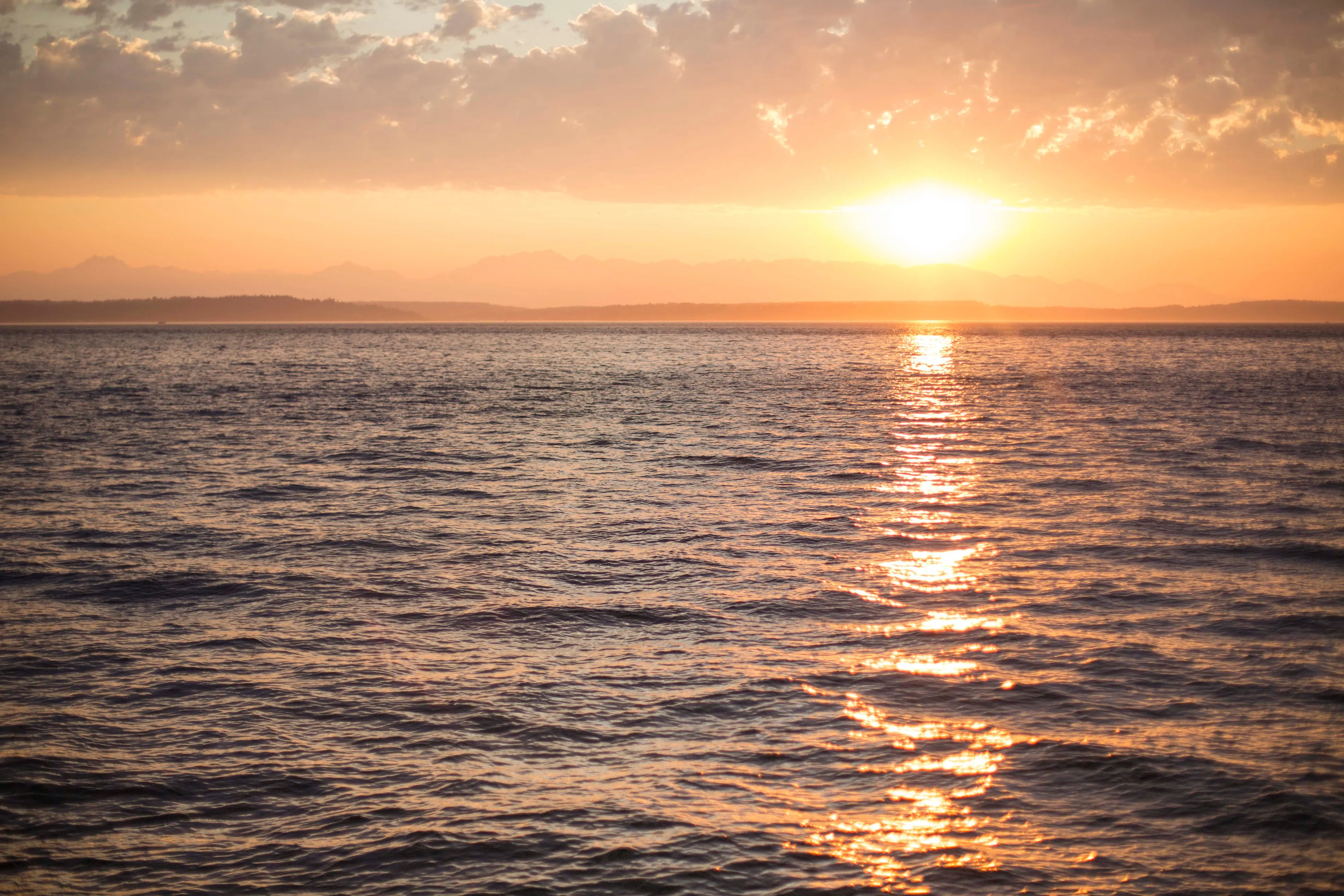 The sun setting over the ocean.