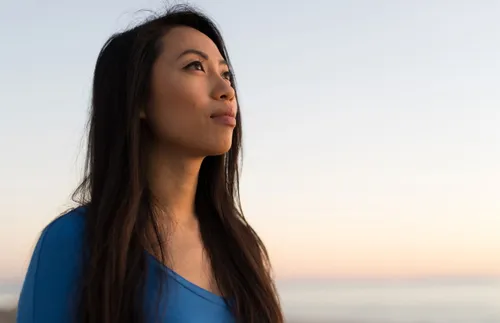 a woman stares into the distance