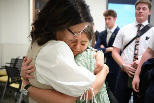 Mother saying goodbye to a missionary daughter