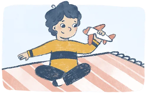 Boy playing with toy airplane