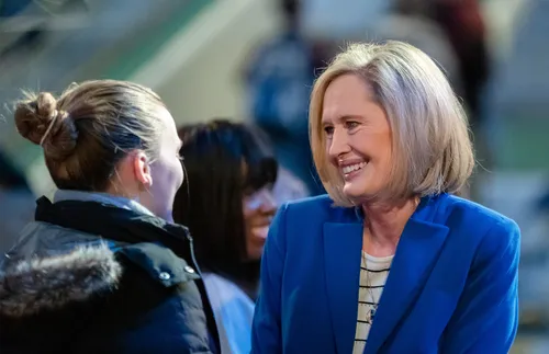 Sister Cordon visiting with young adults