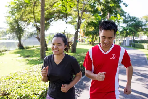 man and woman running together