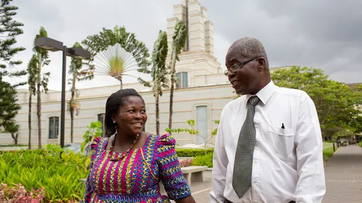 A couple walking outside the Accra Ghana Temple