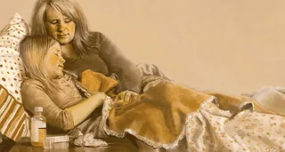 mother with sick daughter in bed