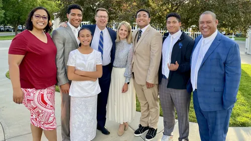 Raass family outside the temple