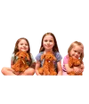 Three girls holding stuffed dog toys