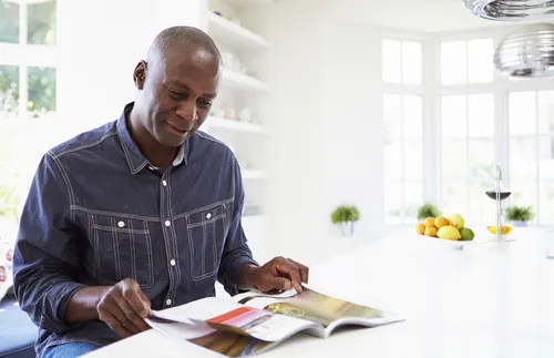 man reading magazine