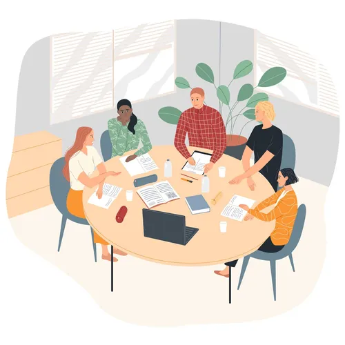 a group of young adults studying at a table