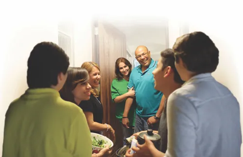 family taking food to another family