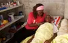 woman helping ill person