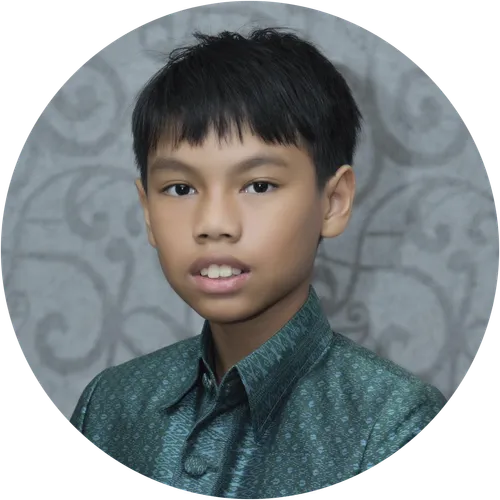 A portrait of an young man with dark hair, wearing a green shirt
