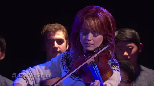 Lindsey Stirling Playing the Violin at a Face-to-Face event