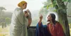 Painting of Jesus and a woman talking next to a well.