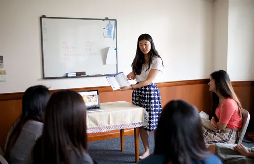 young women having a lesson at church