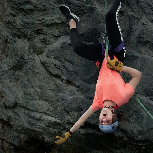 young woman rock climbing
