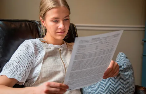 young woman reading her patriarchal blessing