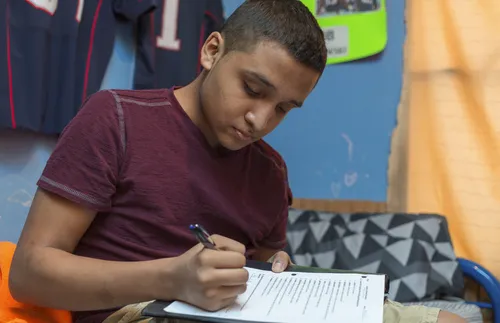 young man doing homework