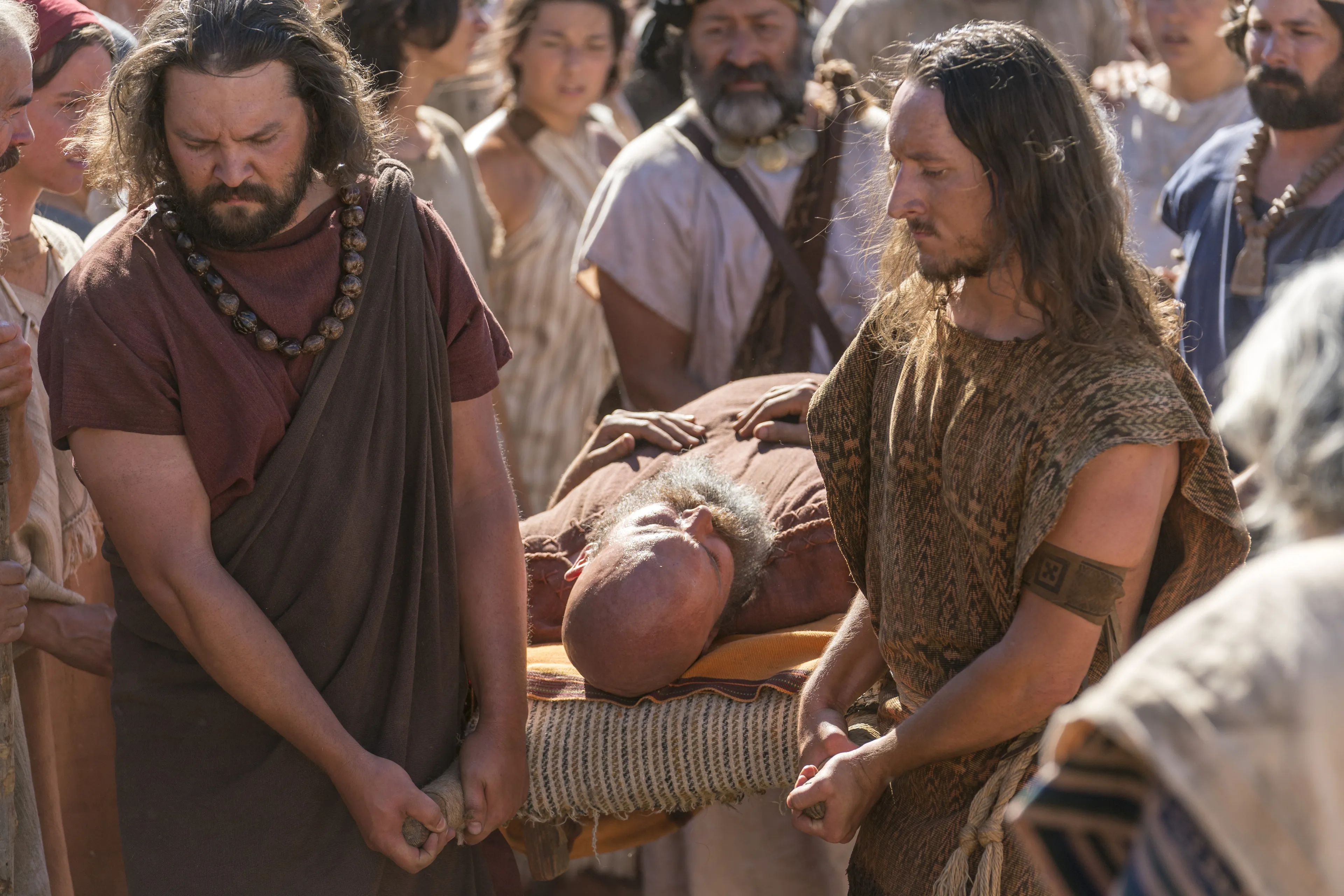 Nephites carry Sherem after he was struck down as a sign from God.