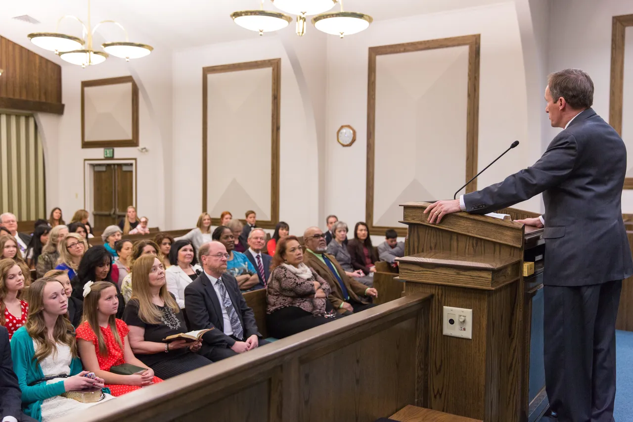 A man giving a sermon in a sacrament meeting