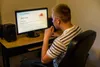 man looking at computer screen