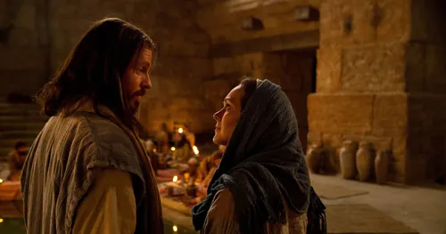 Jesus talking to Mary at a wedding feast.