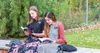 two sister missionaries reading