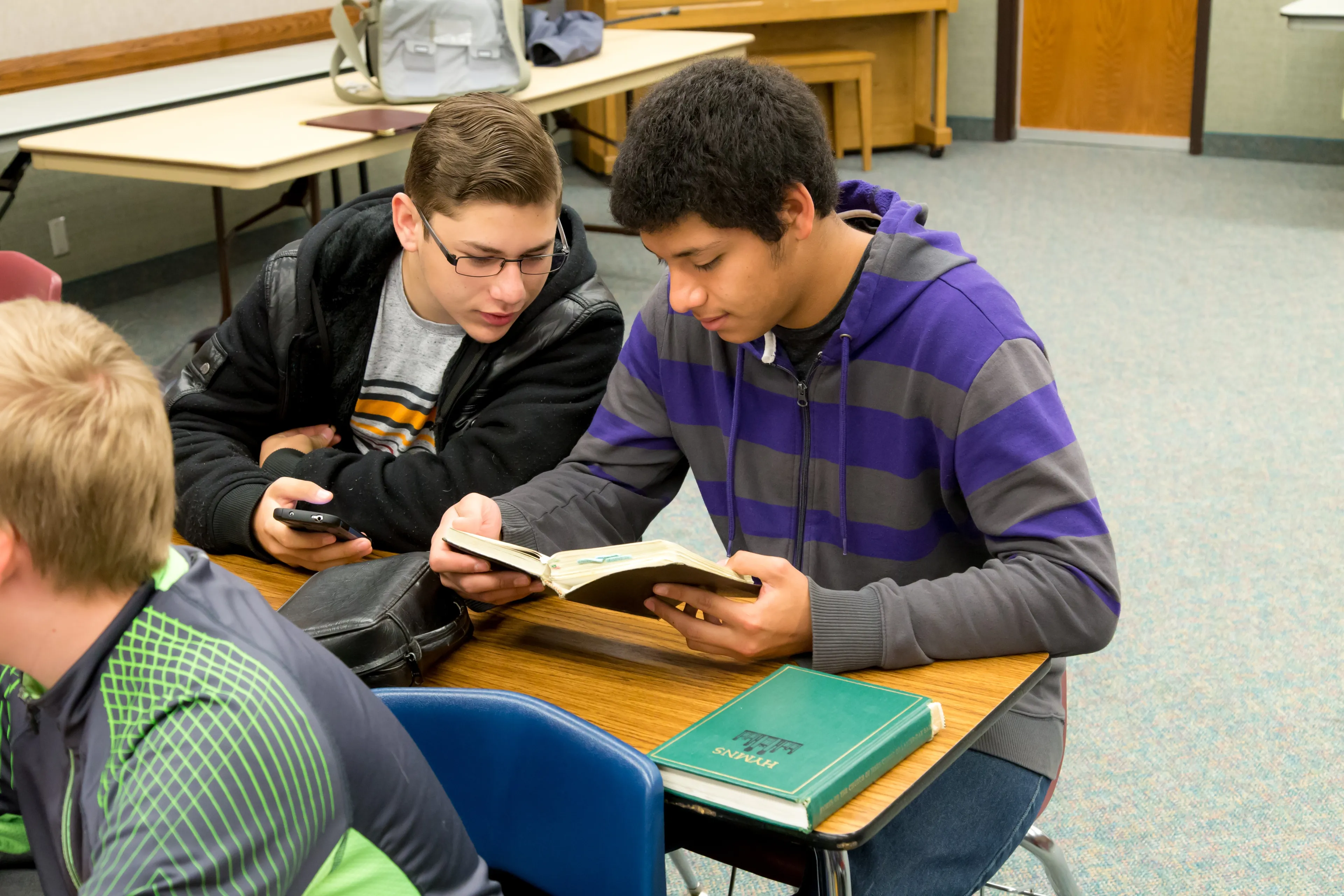 Students sharing scriptures in a seminary class.