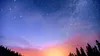 sunset with stars overhead in forested area