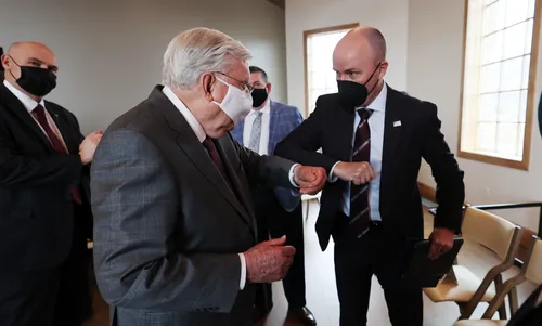 President M. Russell Ballard greeting Utah governor Spencer J. Cox 