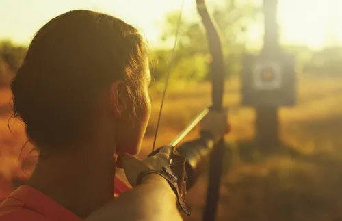 woman about to shoot an arrow