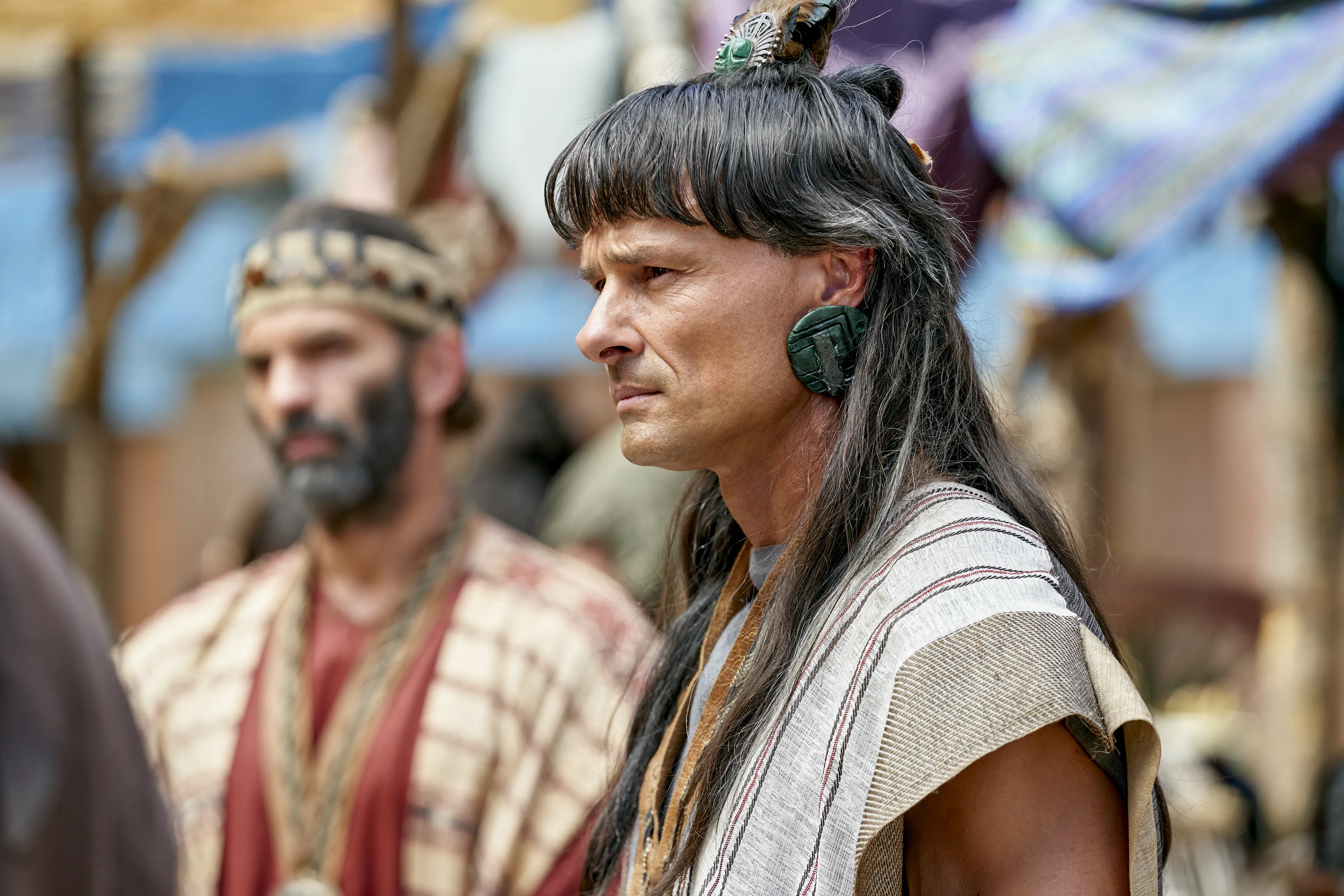 A lawyer watches as Alma the Younger, Amulek, and Zeezrom speak together in the city of Ammonihah.