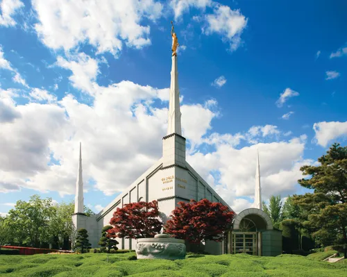 The Seoul Korea Temple, with a view of the entrance, grounds, and spires during the daytime.