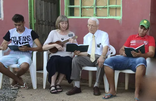 the Romrells playing a ukulele